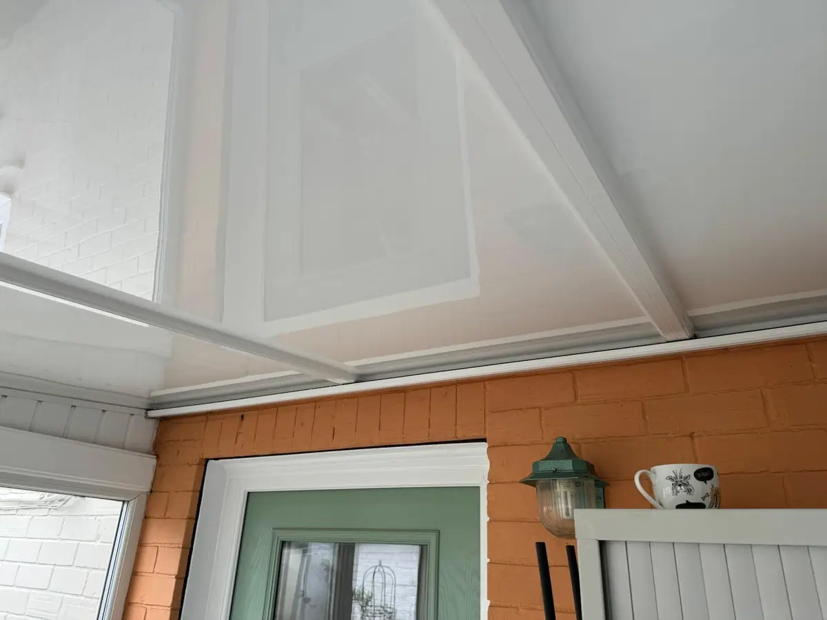 Tidy finish where the lean-to's panelled ceiling meets the house's back door